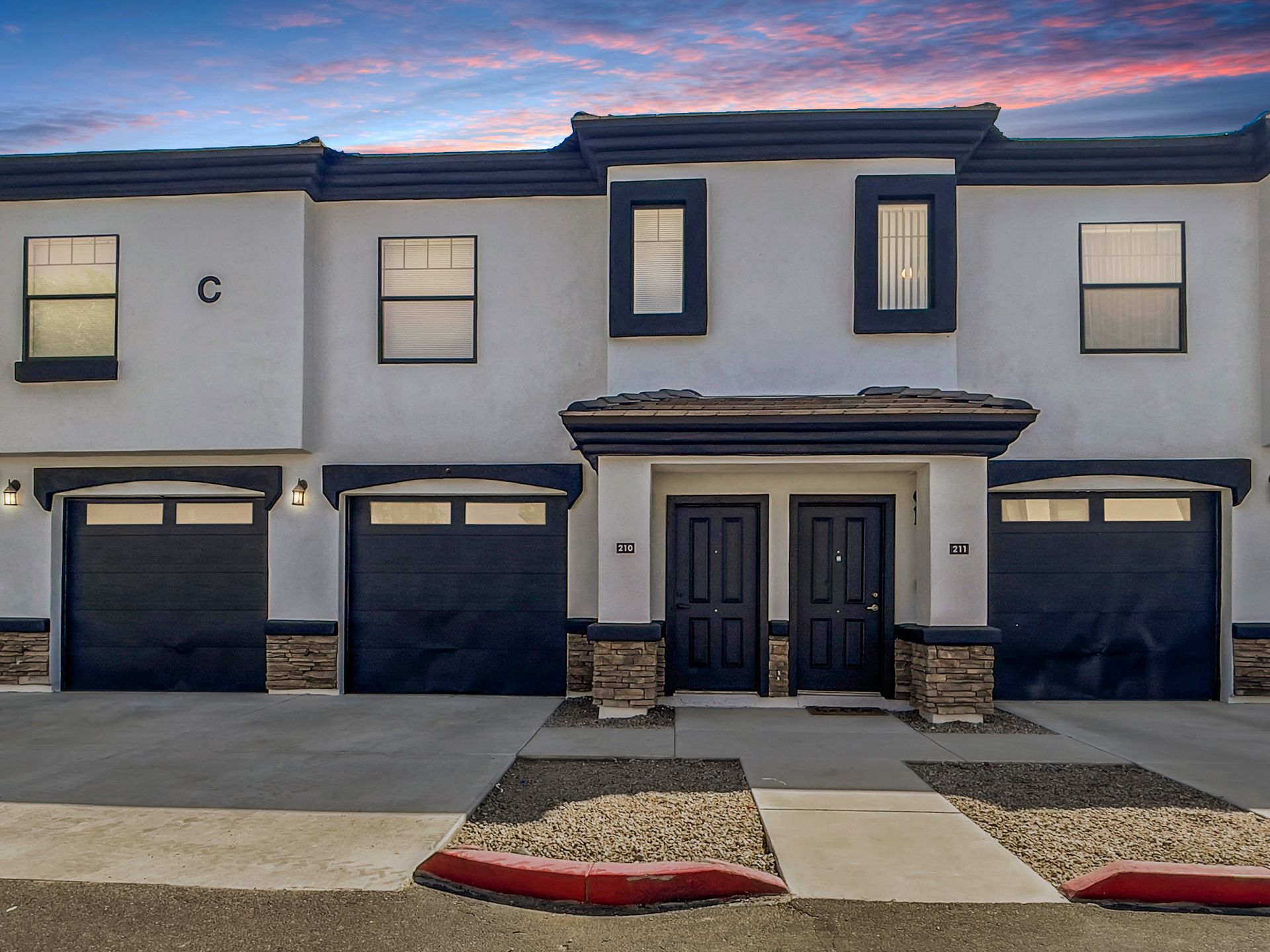 Fringe on 61st townhome exterior with attached garages.