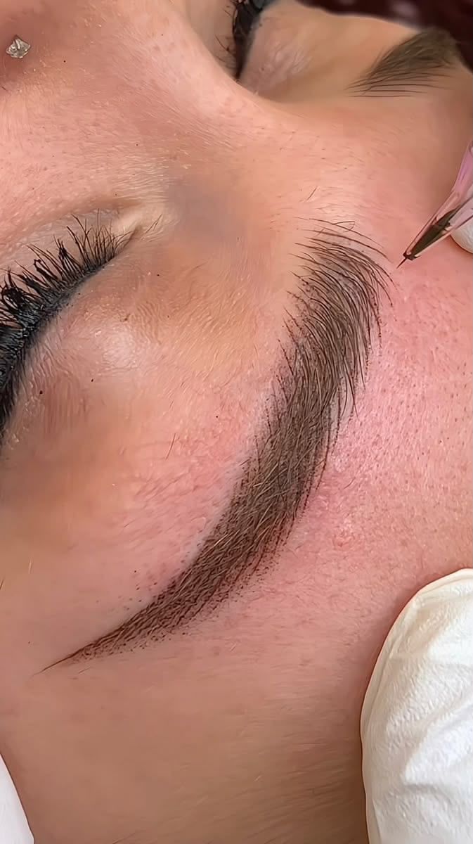 Microblading procedure, hair-by-hair brow strokes at Hairdoctors Miami