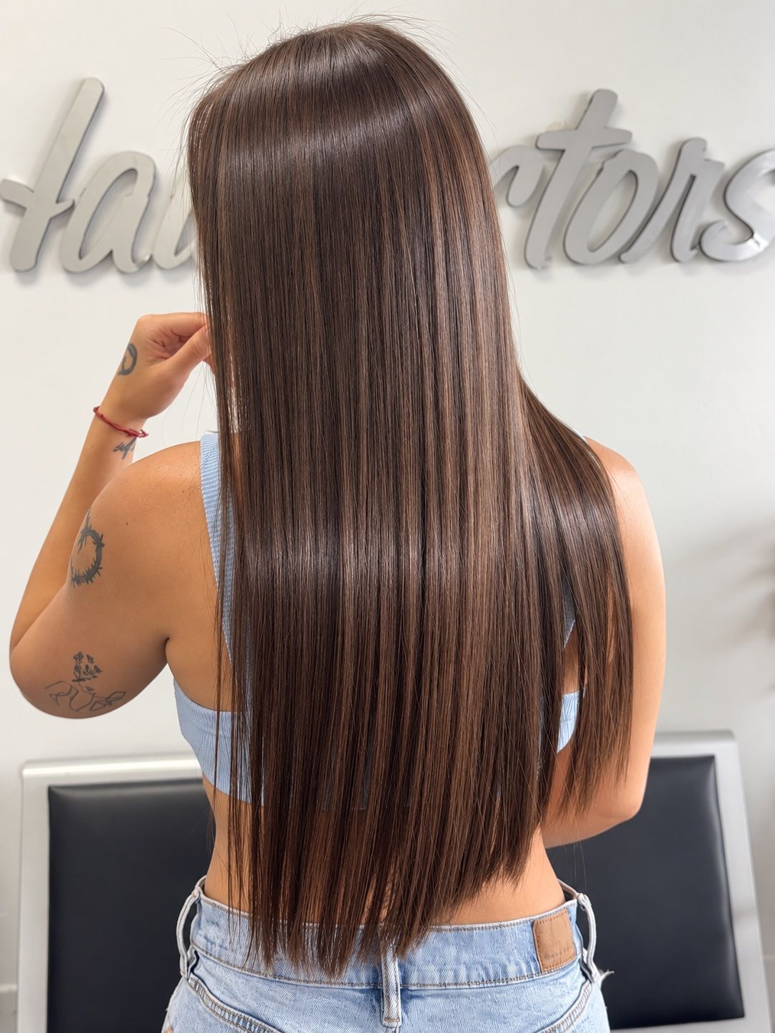Long dark brown hair after a smoothing treatment at Hairdoctors Miami