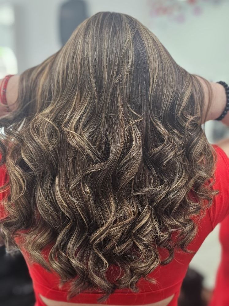 highlights blond curly hair done at hair salon