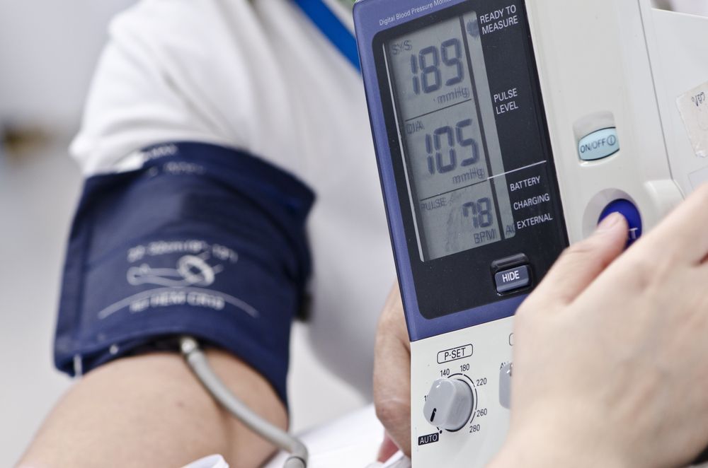 Blood Pressure Monitor on A Person Arm Showing Readings — Rainbow Beach General Practice in Rainbow Beach, QLD