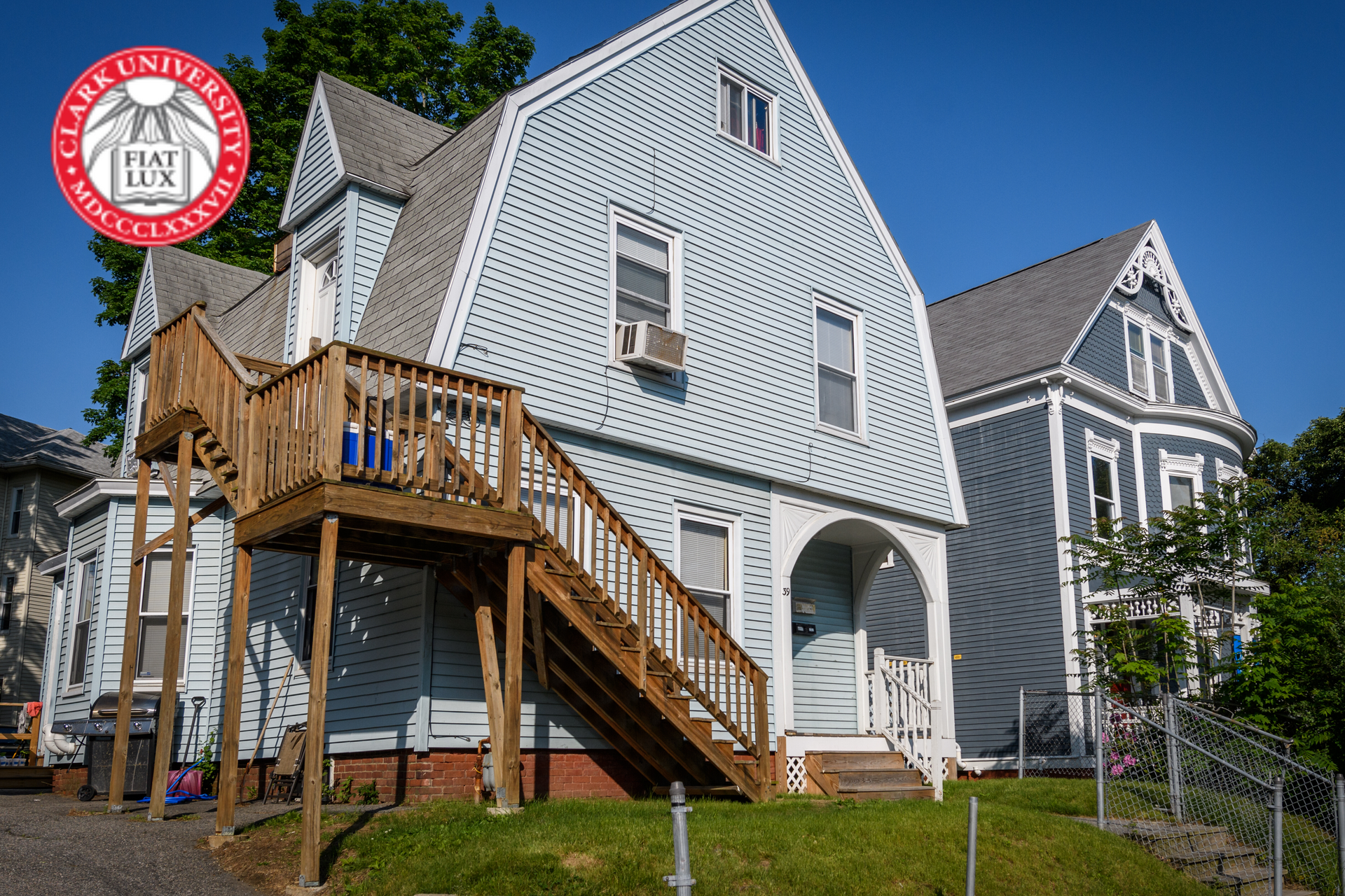 A house with stairs and a sign that says lake university