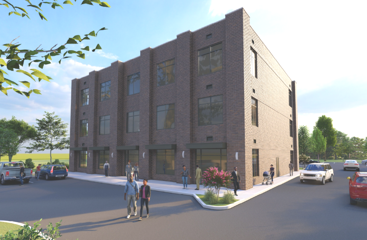 Brown brick commercial building with large windows and a parking lot.