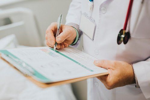 Signing a Paper — Nashville, TN — Nashville Healthcare Center Signing a Paper — Nashville, TN — Nashville Healthcare Center