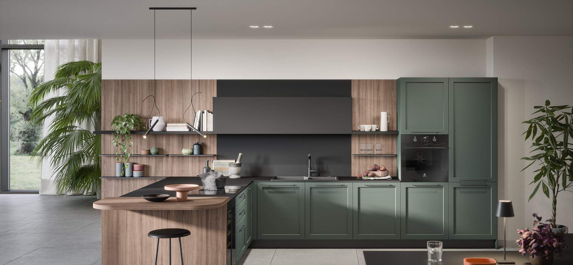 Cucina moderna con mobili verdi, isola in legno, elettrodomestici neri e luce naturale.