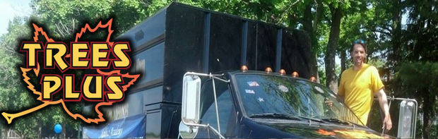Trees Plus logo beside a truck with a man in a yellow shirt standing outdoors