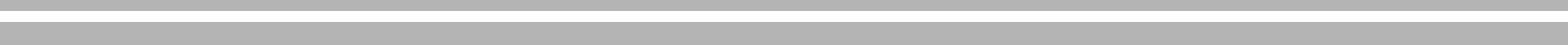 A blurry, horizontal gradient of white fading into light gray.