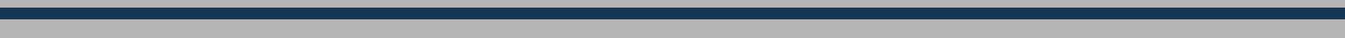 A thin, horizontal strip showing a soft grey-to-blue gradient transition.
