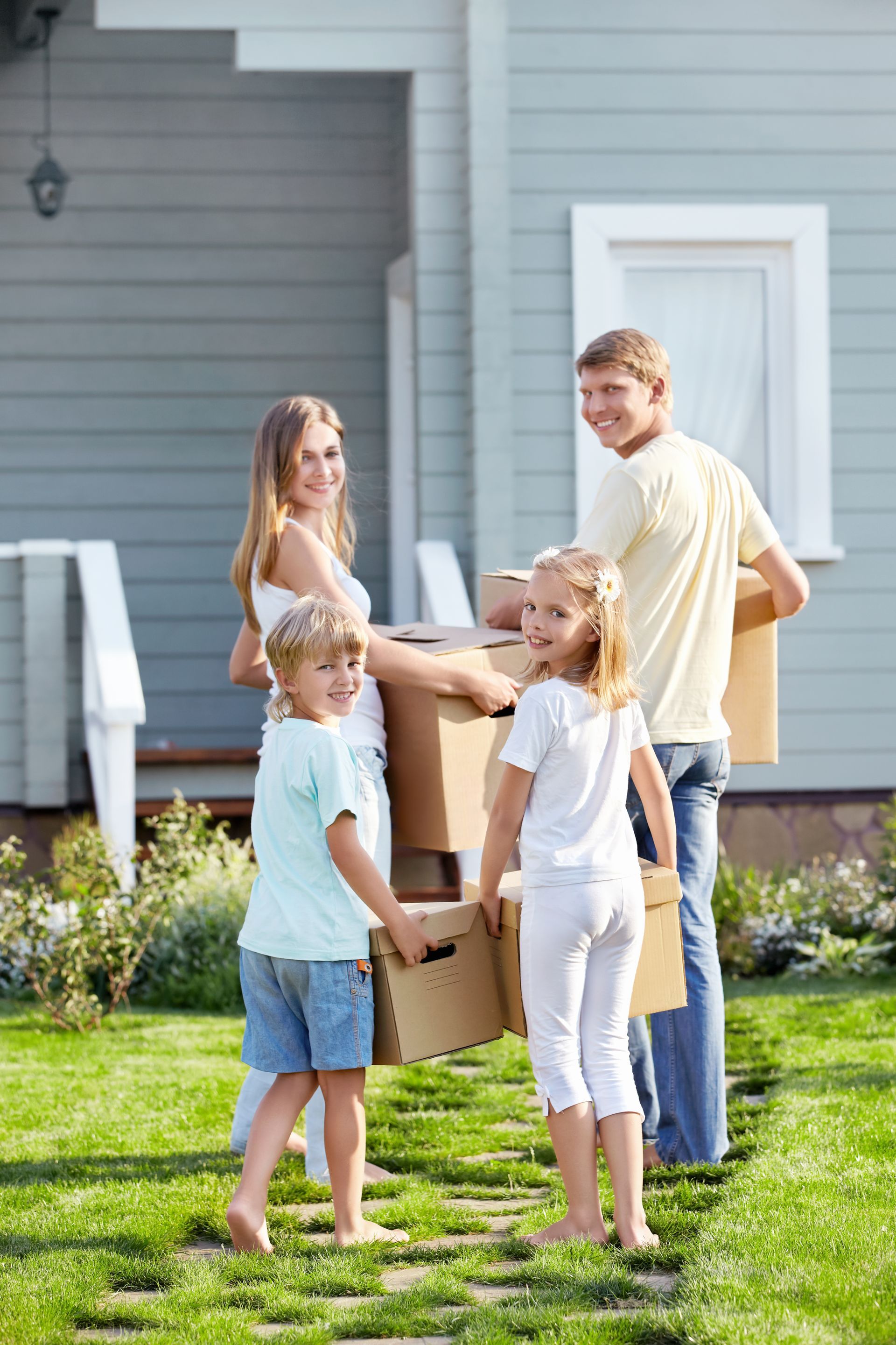 family carrying boxes