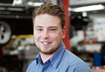 Smiling young man looking at camera | Dale Adams Automotive Specialists