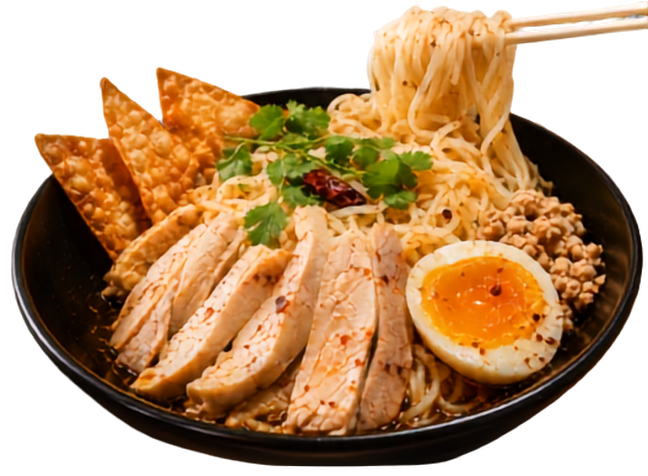 Black bowl of noodle soup with sliced chicken, half-boiled egg, minced meat, herbs, and crispy crackers
