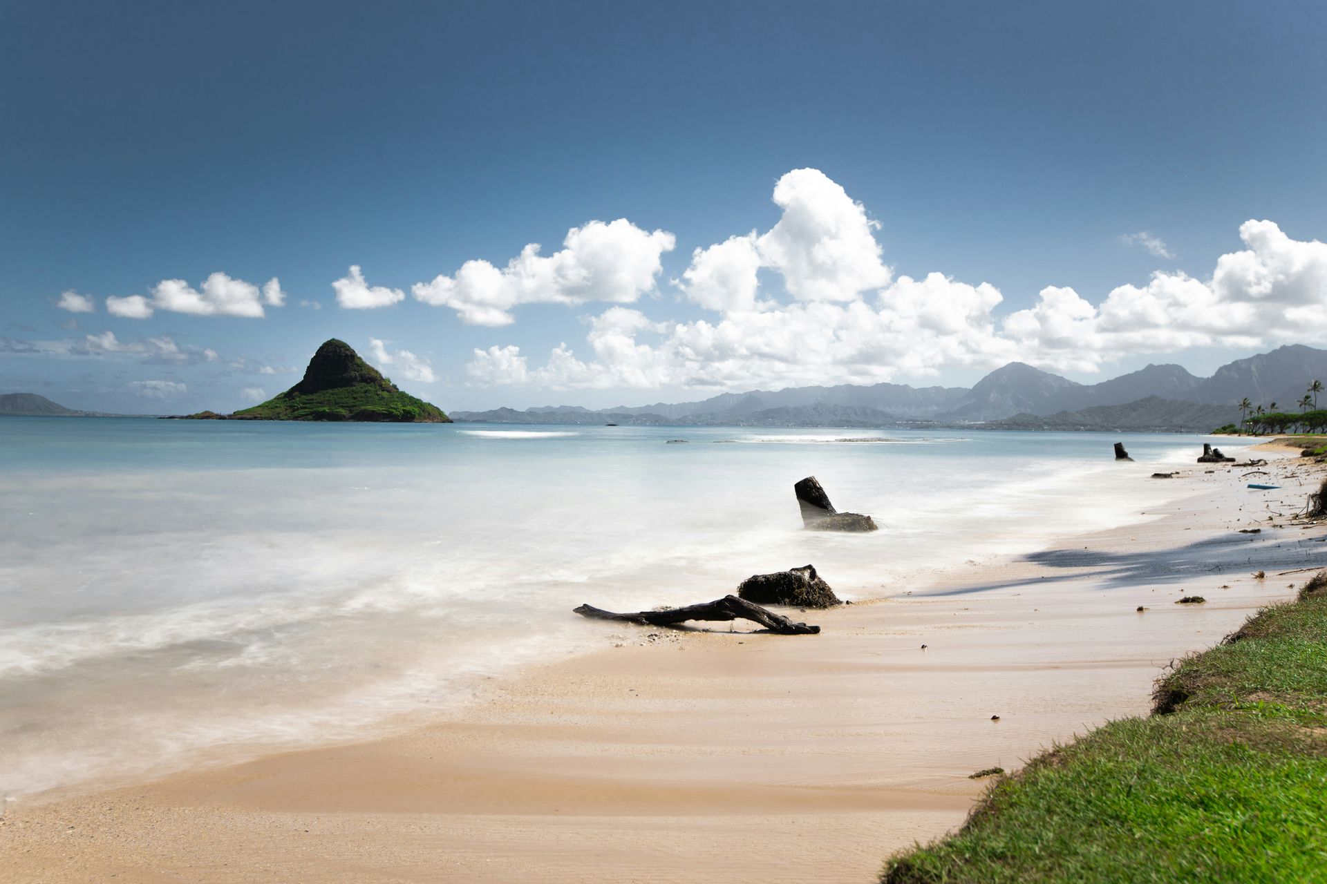 Scenic beach at Kualoa Beach Park with mountains in the background