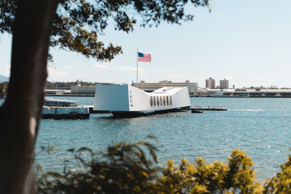The USS Arizona Memorial over calm water at Pearl Harbor, Oahu