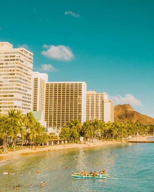 Waikiki Beach lined with resort hotels and Diamond Head in the background