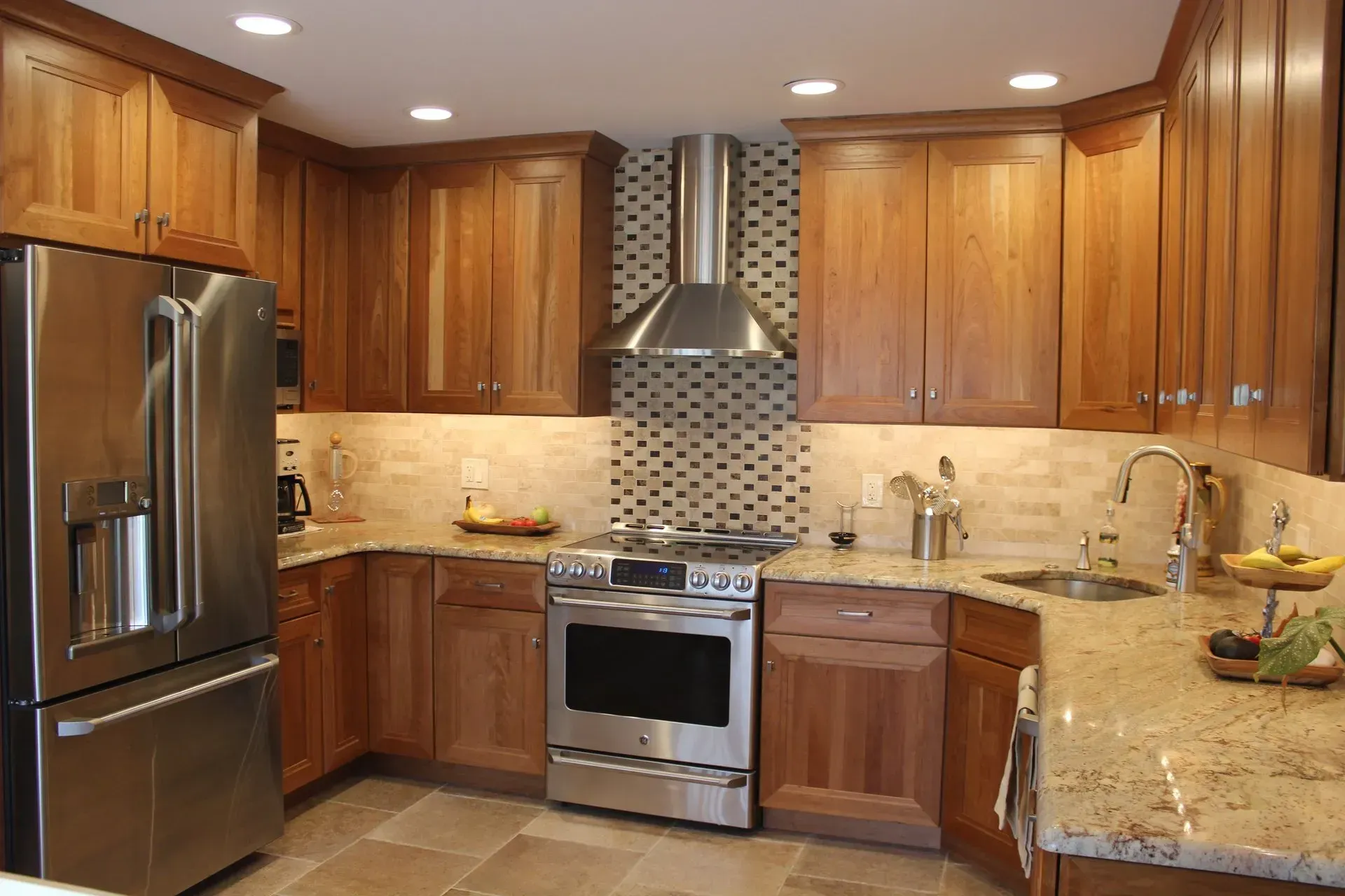 Modern kitchen with wood cabinets, stainless steel appliances, and granite countertops In Richboro PA