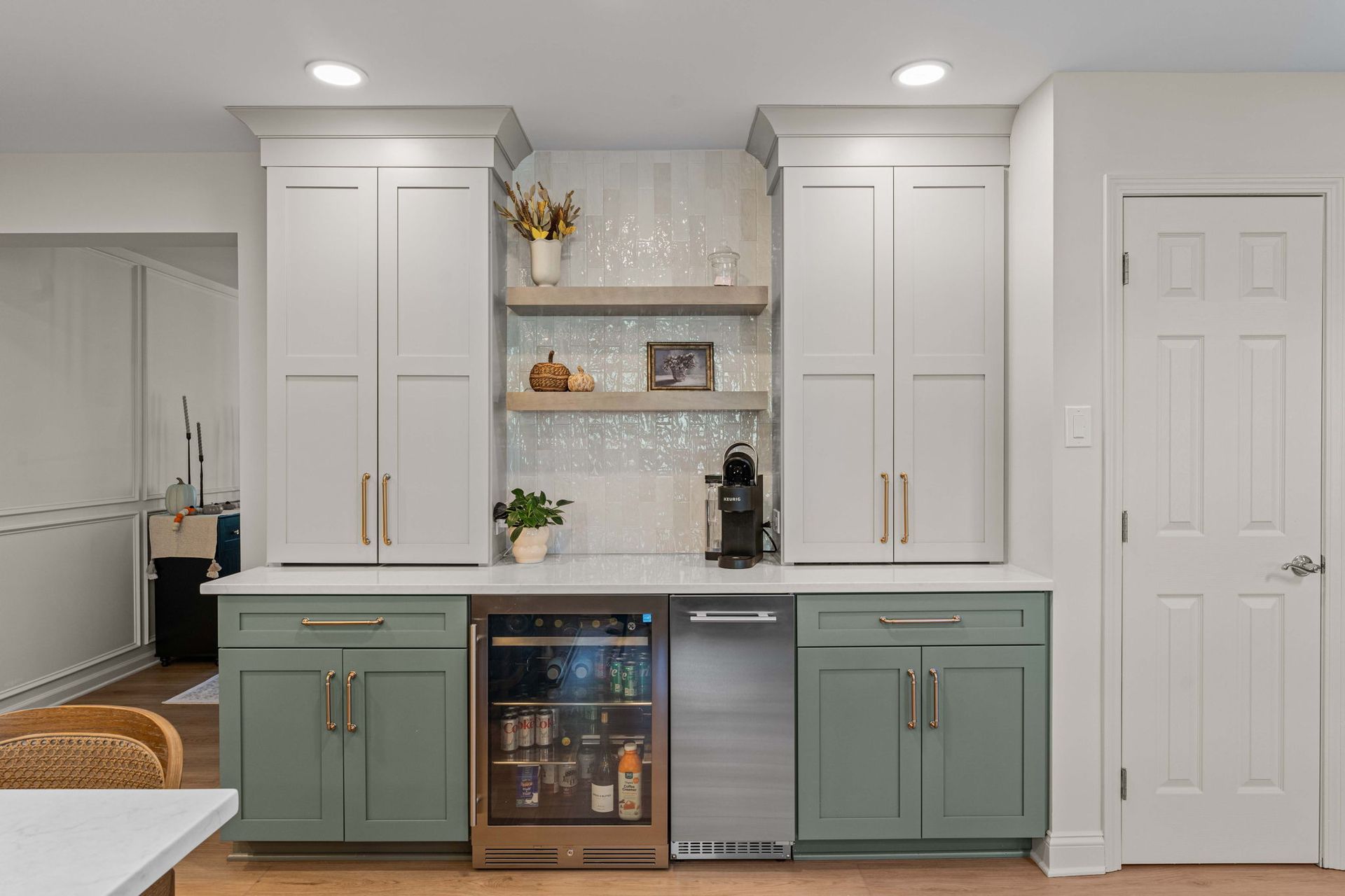 Modern kitchen coffee bar with mint lower cabinets, white uppers, shelves, and beverage fridge in Bucks County PA
