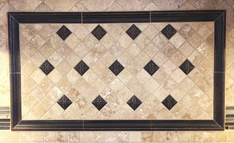 Framed beige diamond-pattern tile mosaic with black diamond accents  In Bucks County PA