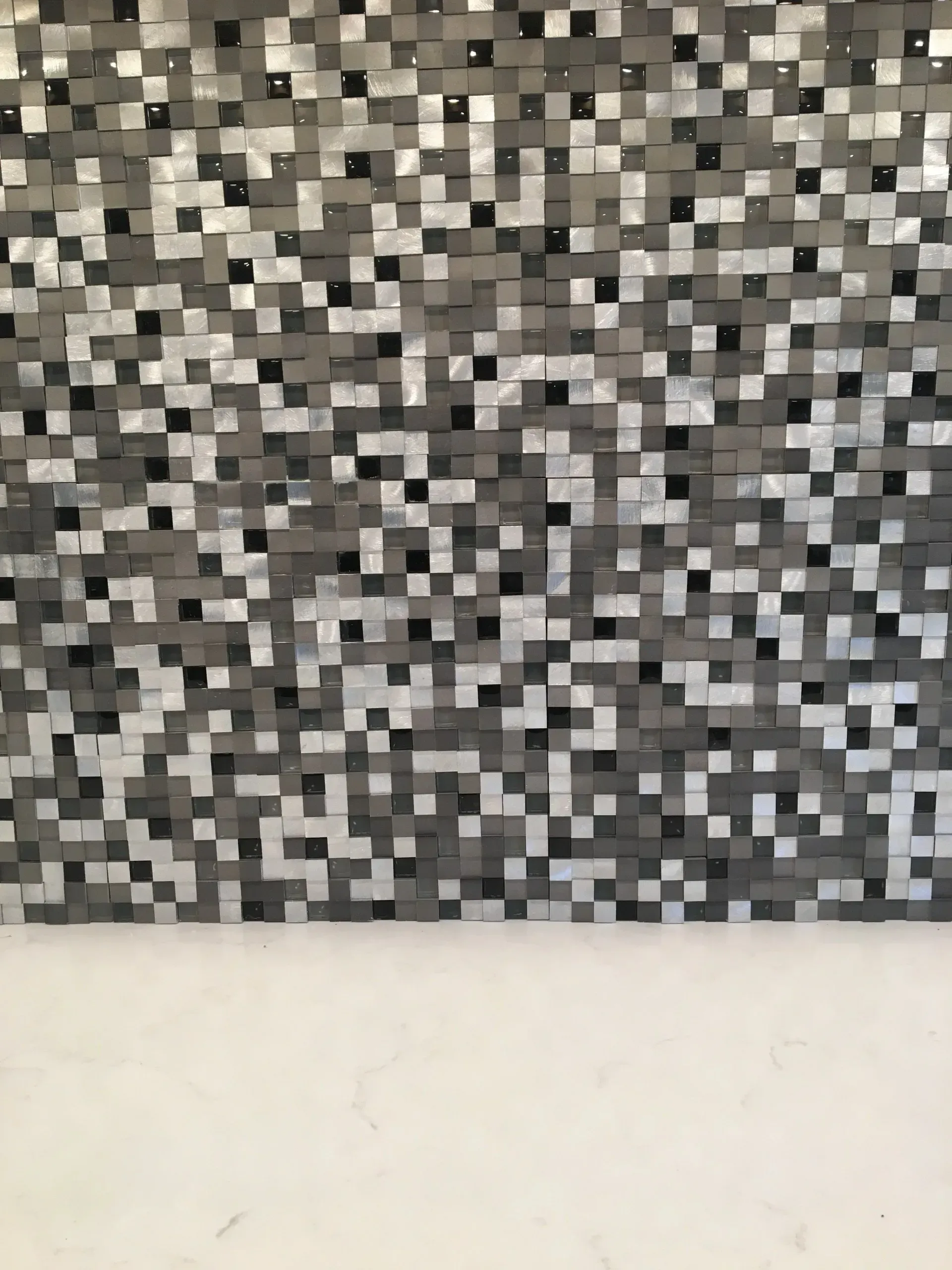 Abstract gray-and-black mosaic pattern above a white surface  In Bucks County PA