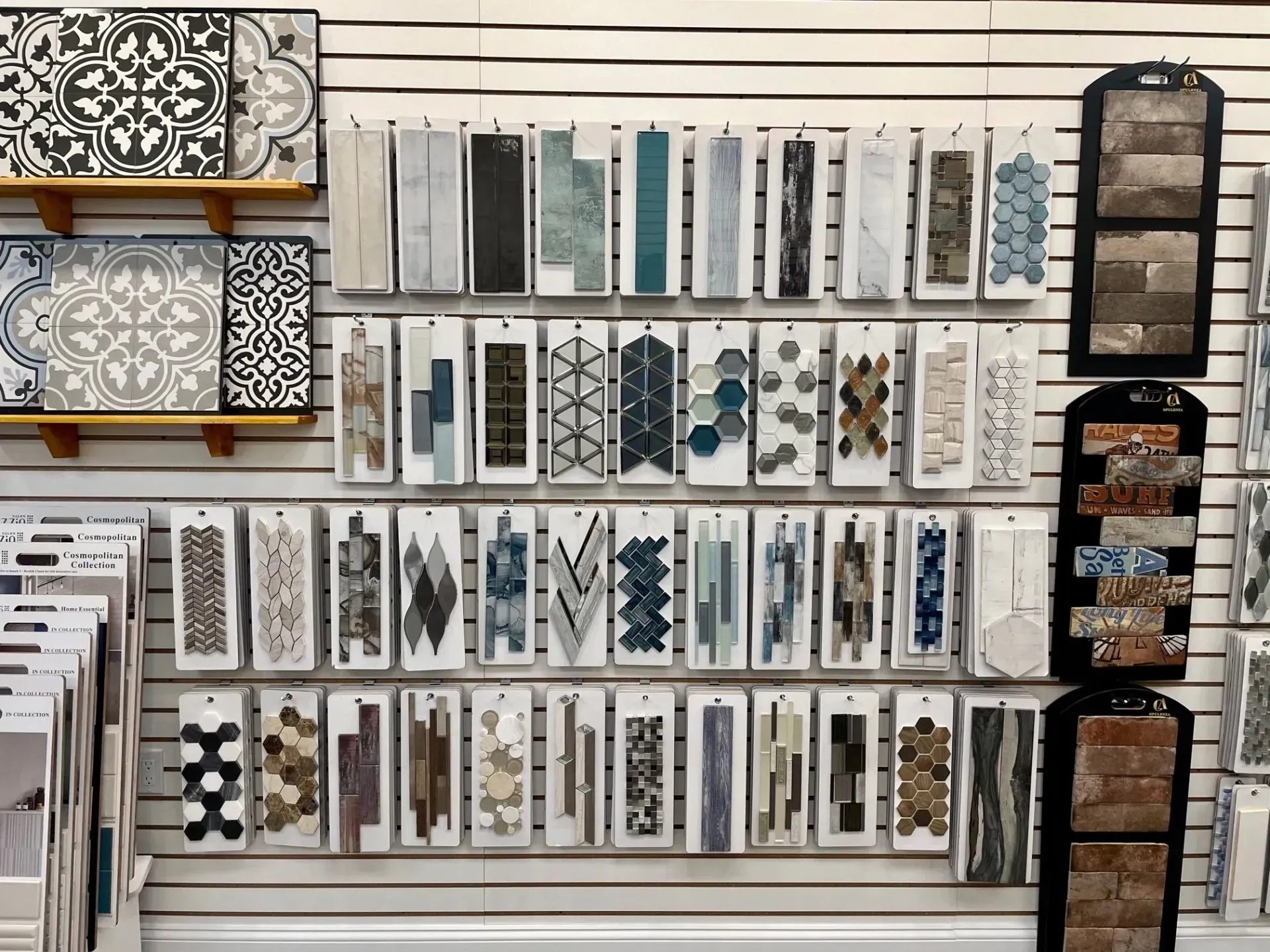 Wall display of assorted decorative tiles and mosaic samples in neutral and blue tones  In Bucks County PA