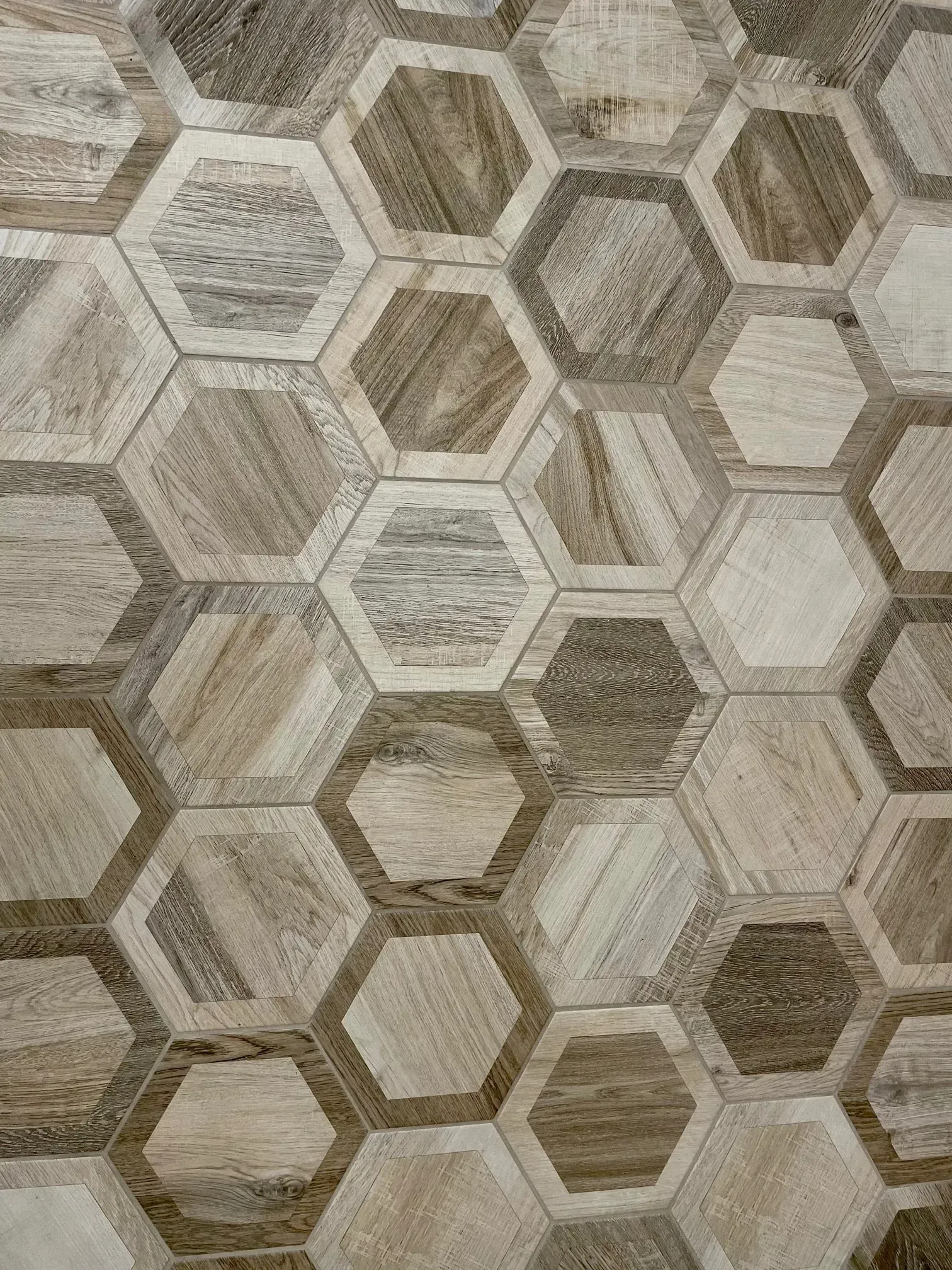 Hexagonal geometric wallpaper in beige and gray tones with a textured wood-like pattern  In Bucks County PA