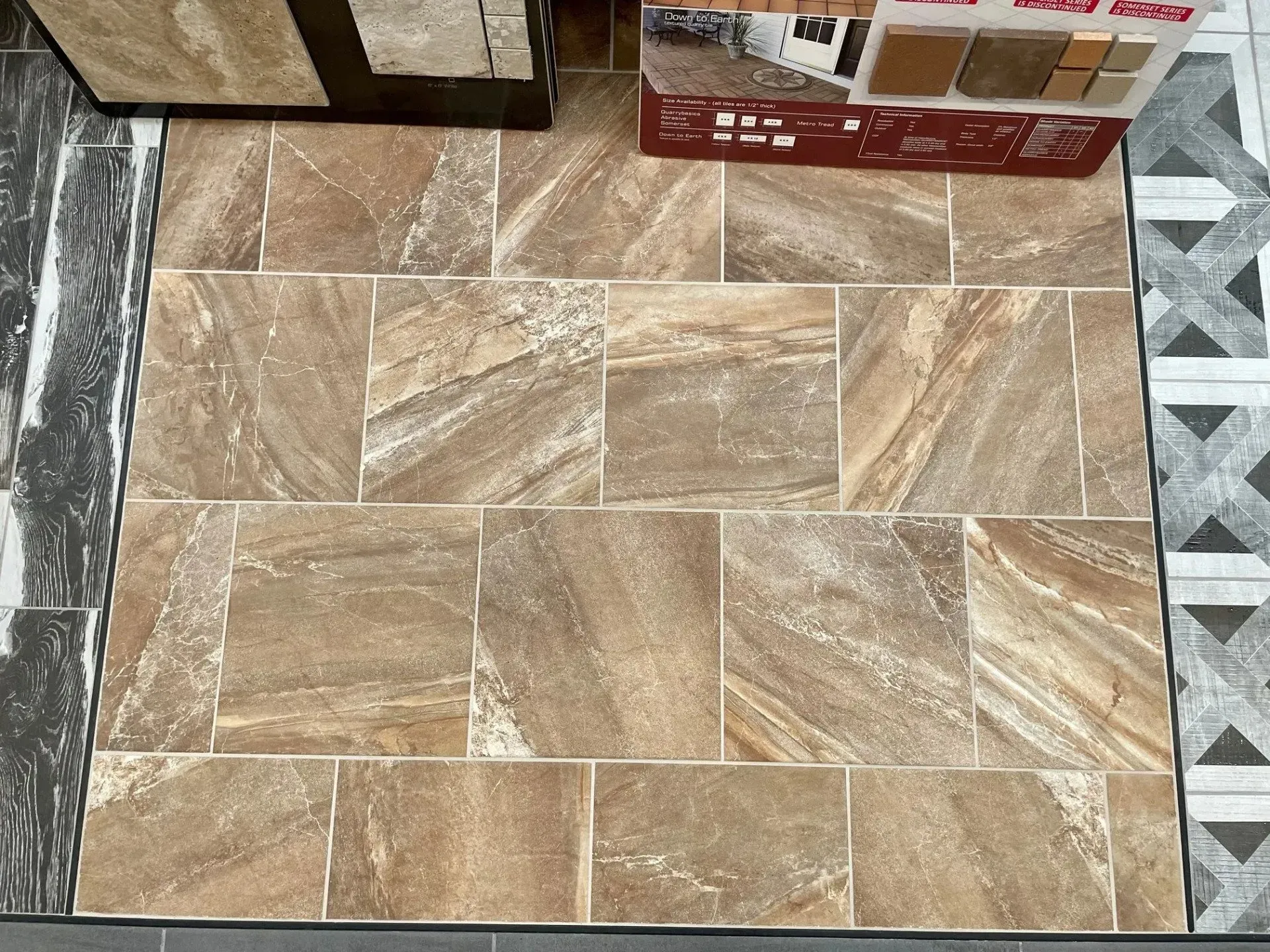 Tan tile floor with rectangular stone-patterned tiles and patterned border trim  In Bucks County PA