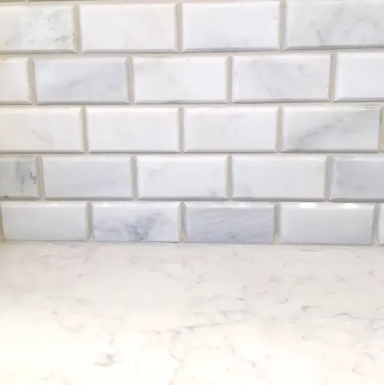 White marble countertop against a white subway tile backsplash In Bucks Country PA