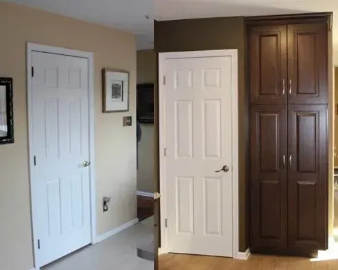 Interior hallway with two white doors beside a tall dark wood cabinet door  In Bucks County PA