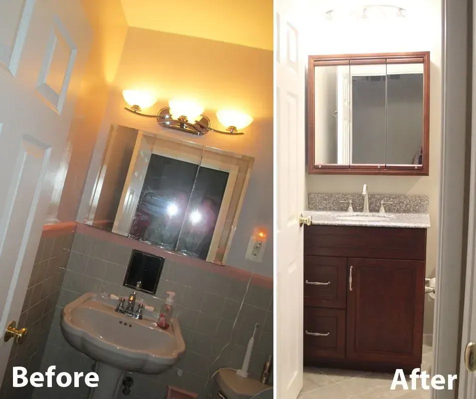 Before-and-after bathroom renovation: old sink and mirror replaced with dark vanity and framed mirror  In Bucks County PA