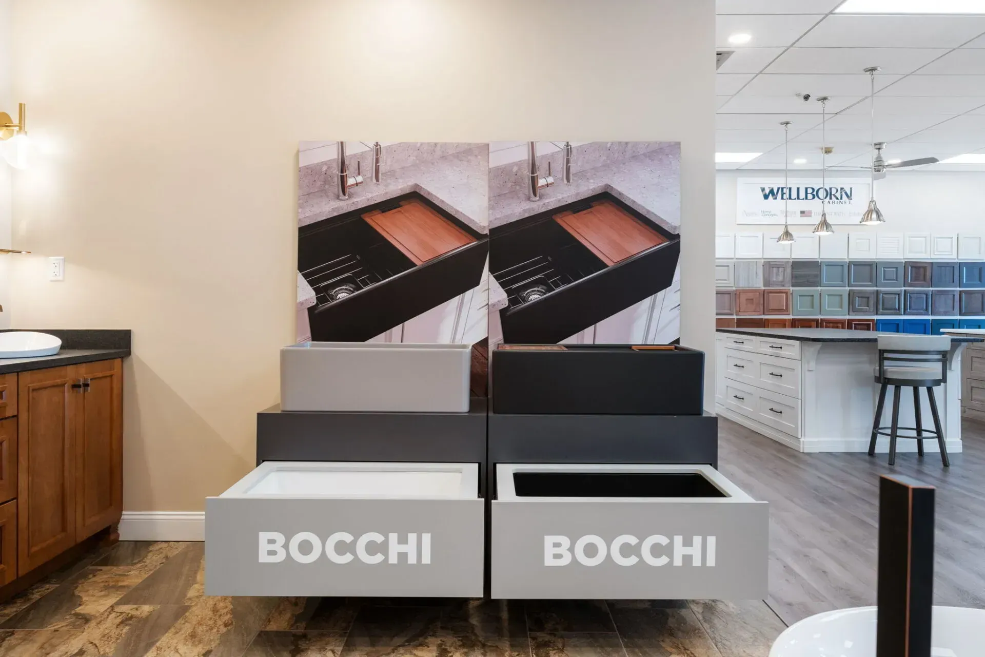 Bocchi display with gray steps, black countertop samples, and wall-mounted kitchen displays in a showroom  In Bucks County PA