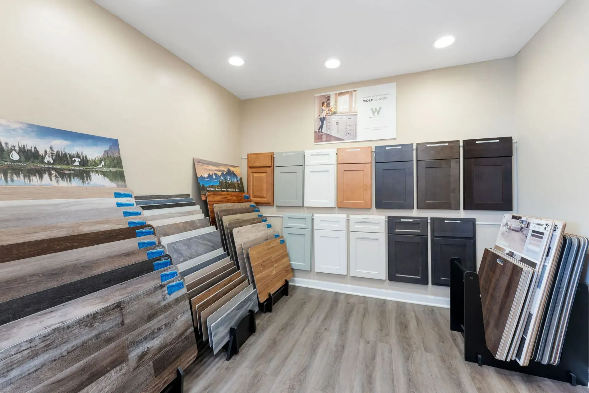 Showroom display of flooring and cabinet samples arranged on shelves in a bright room  In Bucks County PA