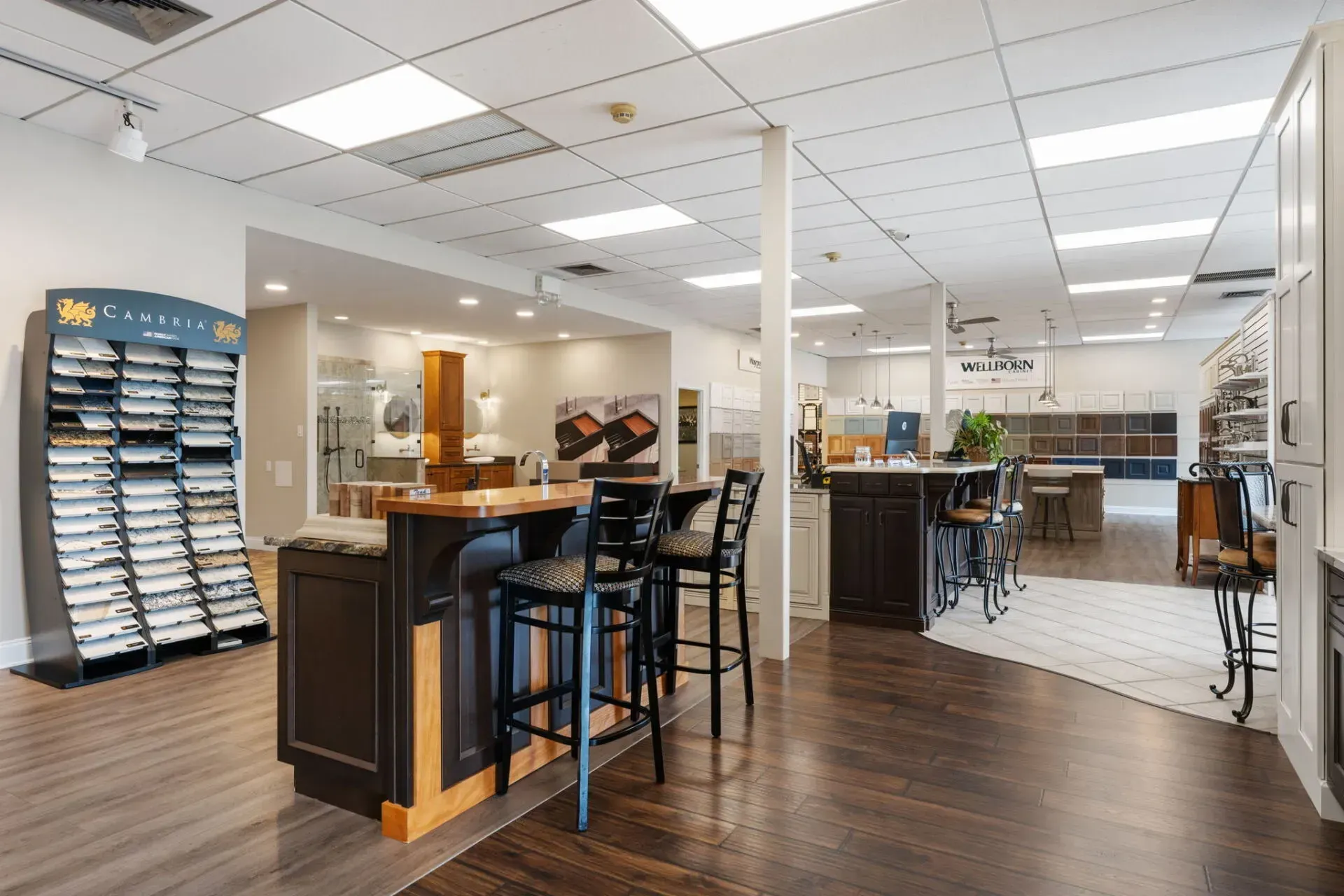 Bright modern office lobby with desks, high stools, and wood flooring  In Bucks County PA