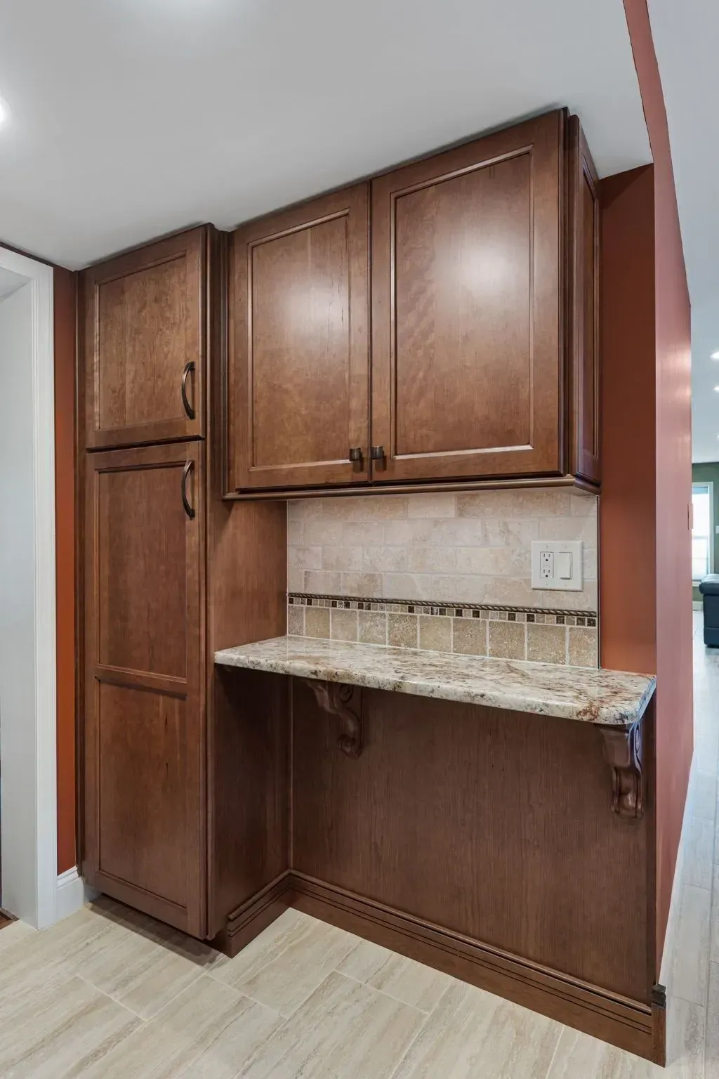 Wooden built-in cabinets with granite countertop in a small kitchen alcove  In Bucks County PA