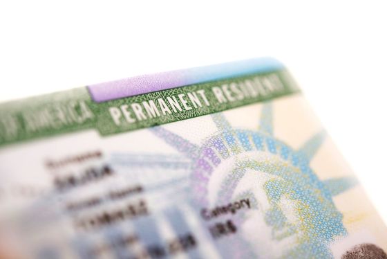 A close up of a green card for a permanent resident.