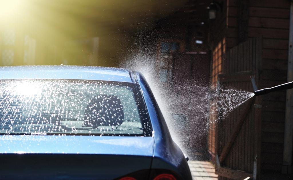 spraying water on car