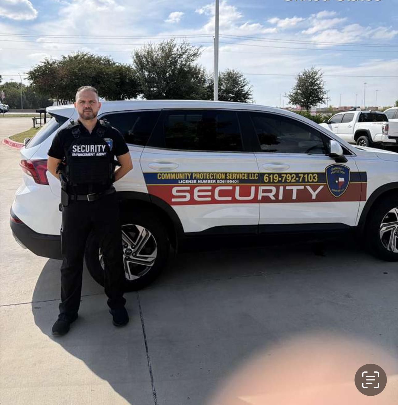 Security guard standing beside a black-and-white patrol SUV in a parking lot.