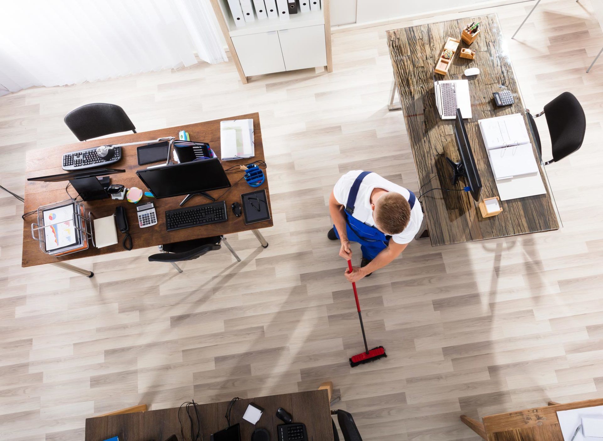 Experienced Cleaning Company — Man Cleaning the Office in Will County Experienced Cleaning Company — Man Cleaning the Office in Will County