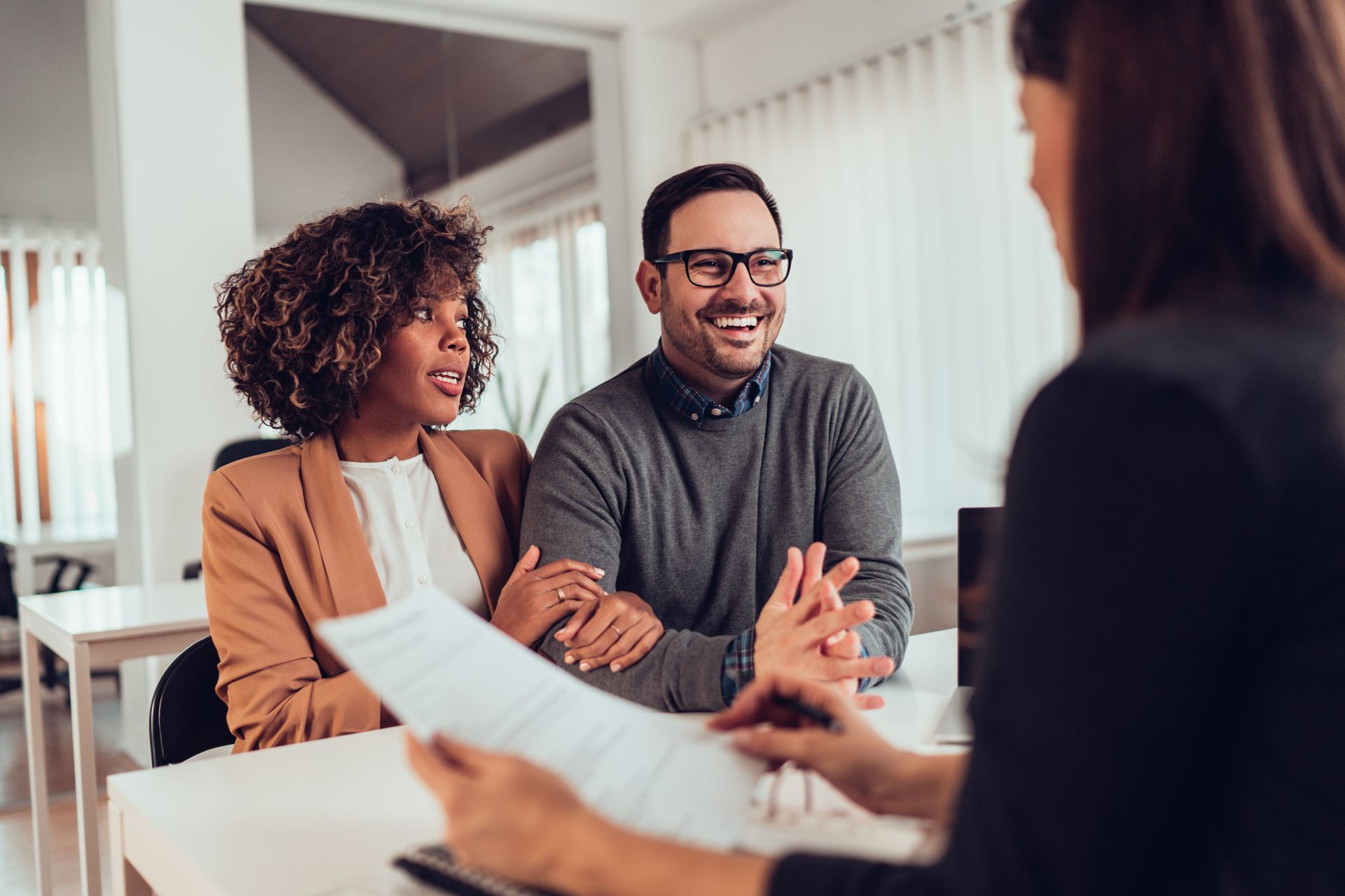 Couple talking with an insurance agent Couple talking with an insurance agent