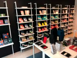 A store filled with lots of books on shelves and tables.