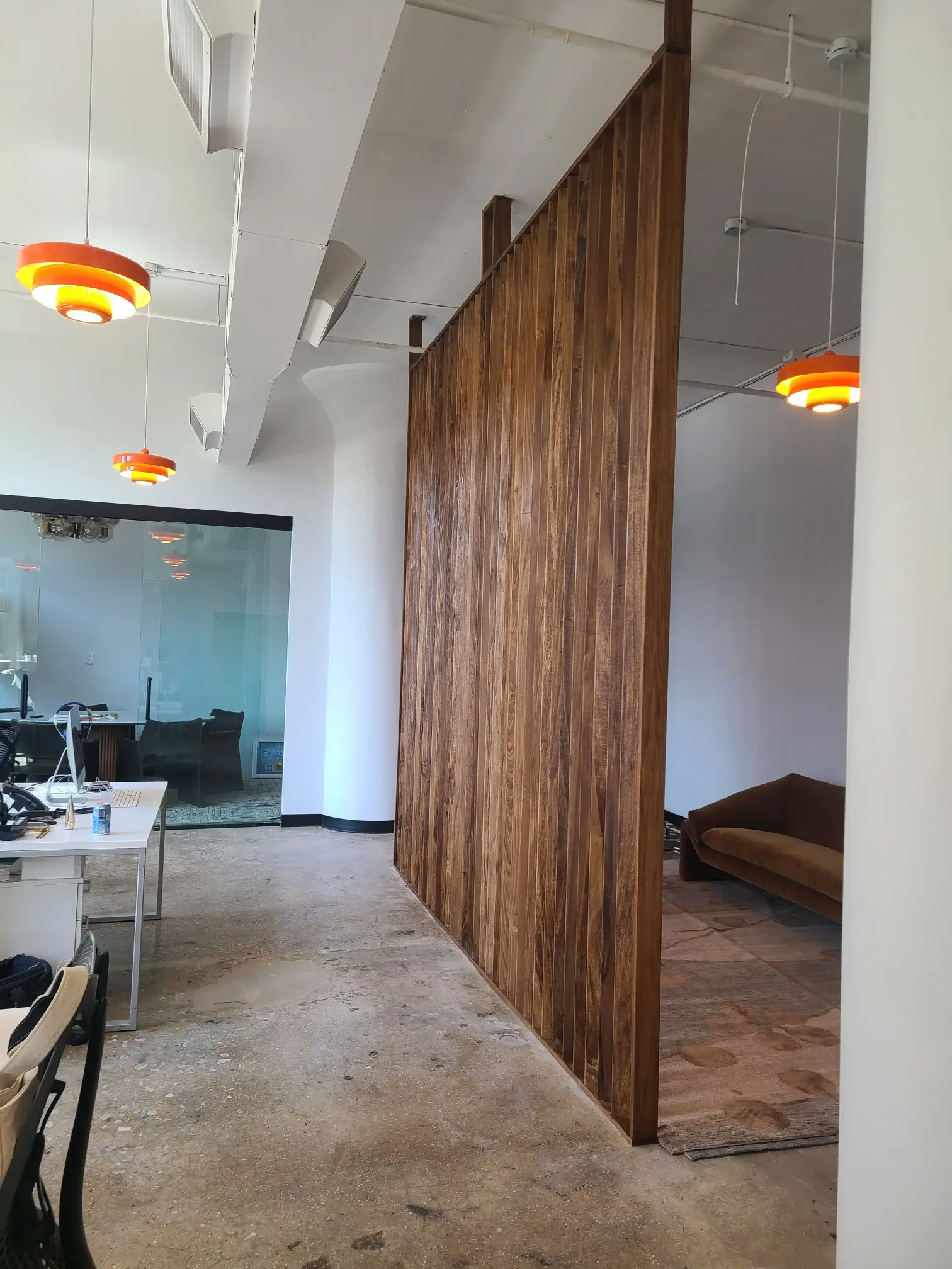 There is a wooden wall in the middle of the room.