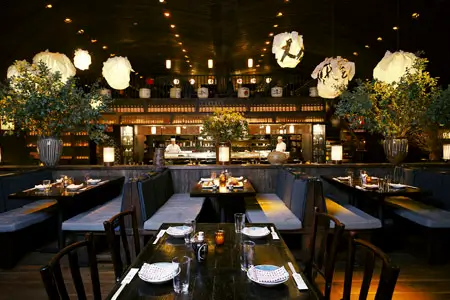 A restaurant with a lot of tables and chairs