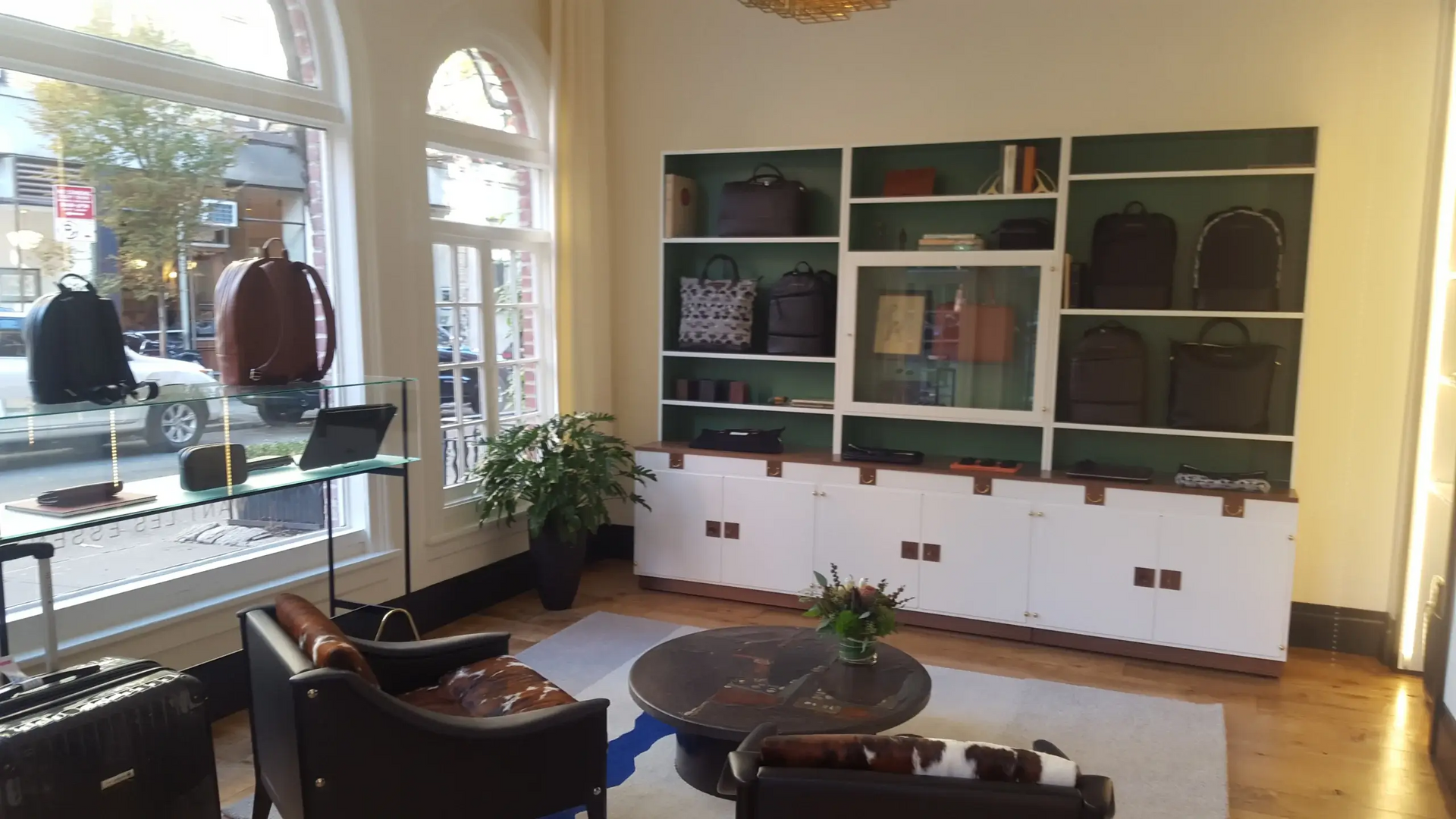 A living room with a lot of furniture and shelves