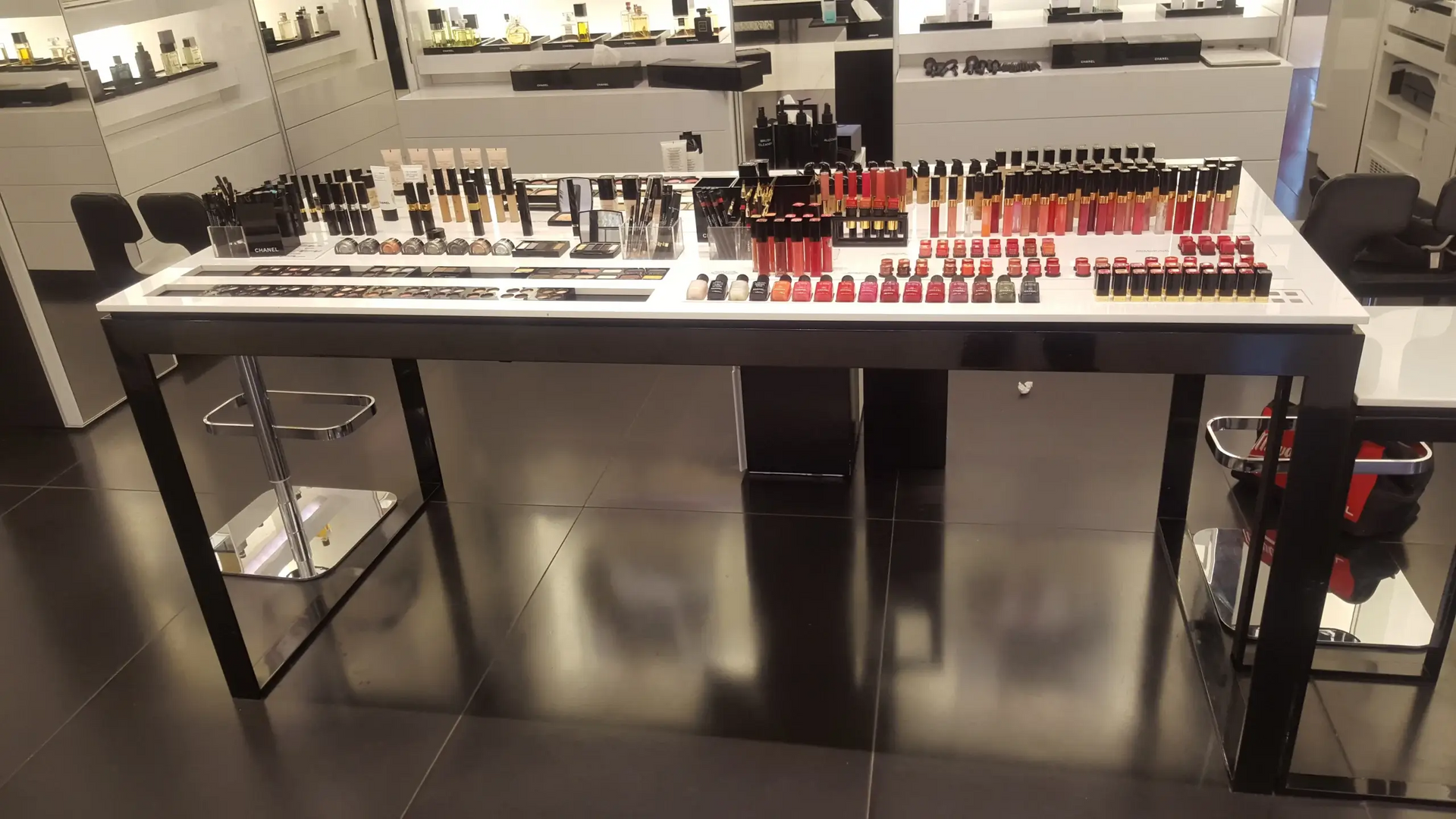 A table with a lot of makeup on it in a store