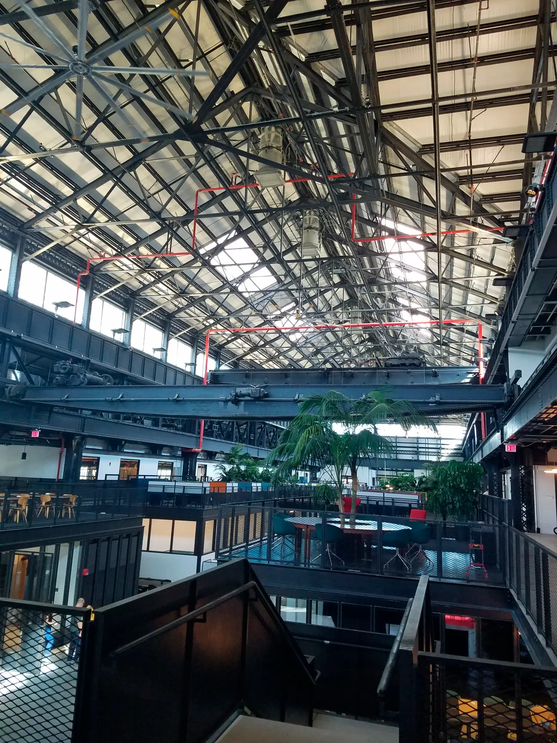 A large building with a roof that is covered in shingles