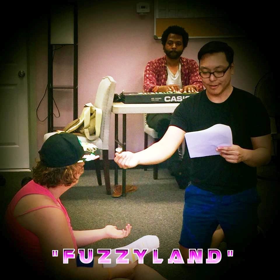 The word fuzzyland that is on a picture
