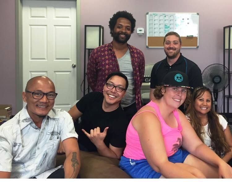 A group of people posing for a picture in a room