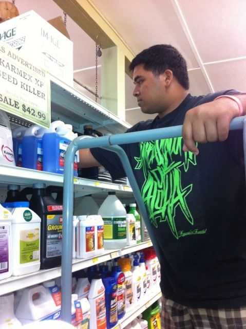 A man in a black shirt with the word aqua on it