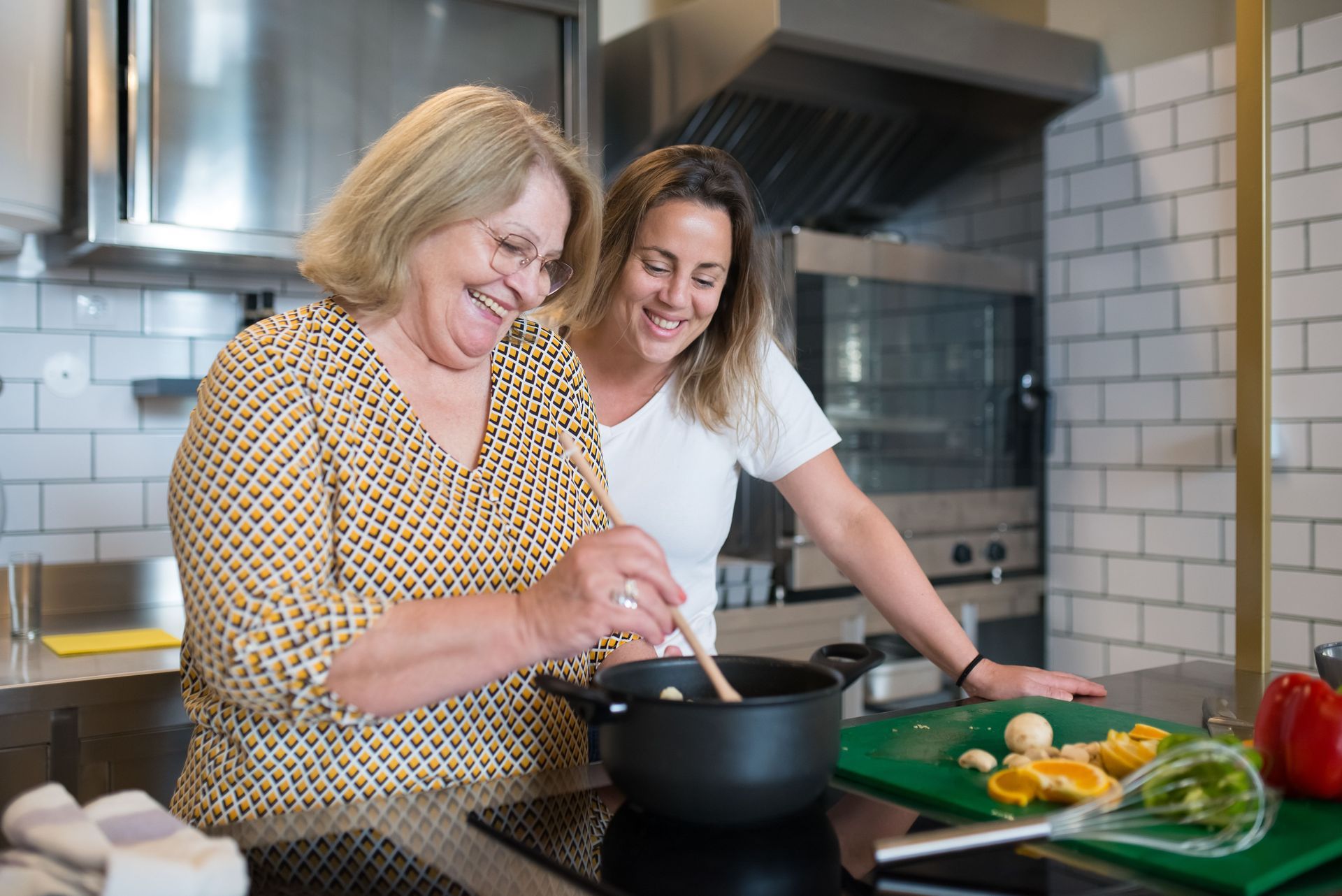Two people preparing a meal together