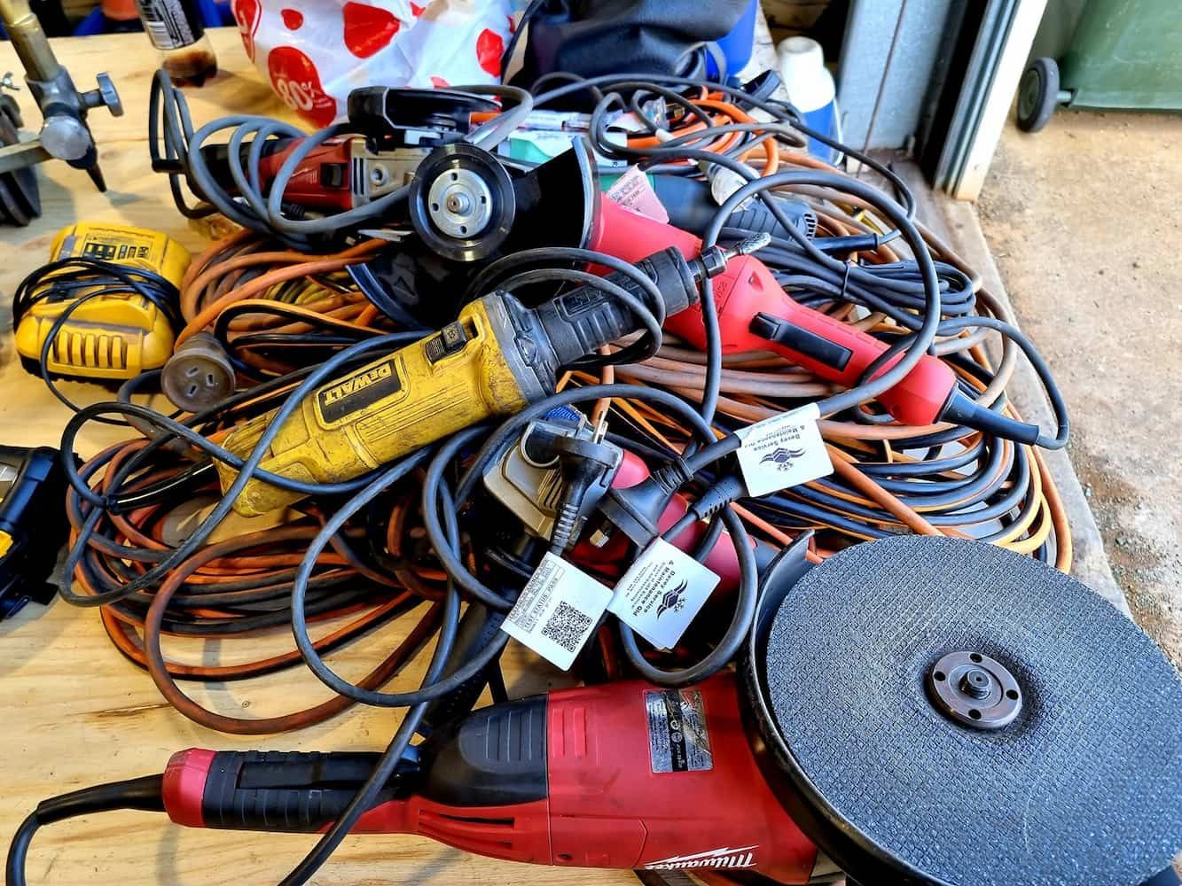 A Bunch Of Tools Are Sitting On A Wooden Table — Davey Service & Maintenance Qld In Clinton, QLD