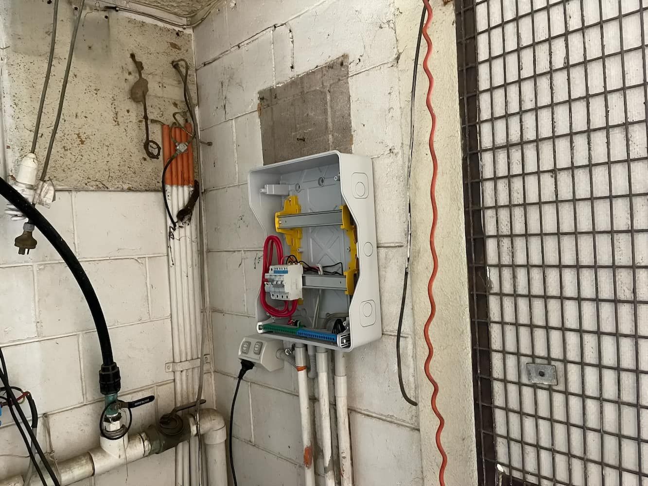 An Electrical Box On The Wall With Wires Coming Out Of It — Davey Service & Maintenance Qld In Clinton, QLD