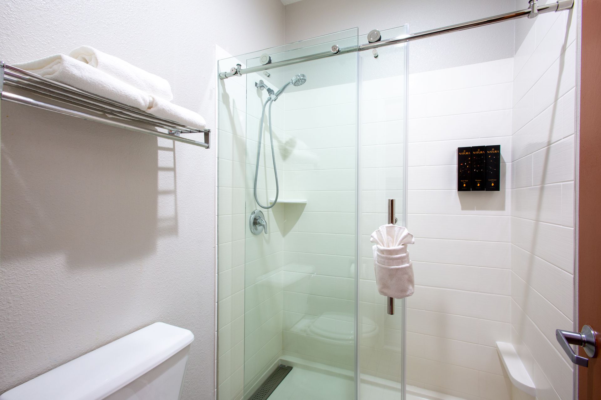 Modern bathroom with large vanity and bright lighting in Panoramic King Fireplace room